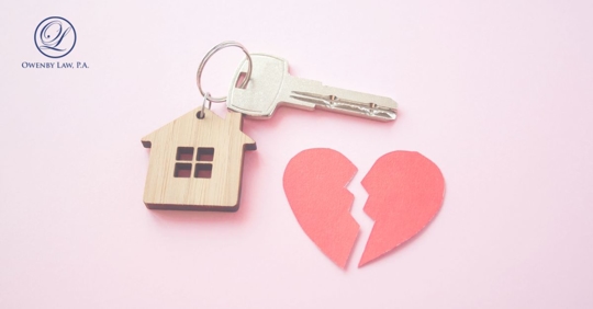 a house key next to a broken heart